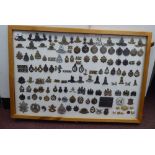 Over one hundred and twenty military cap badges and other insignia, some copies: to include Royal
