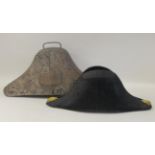 A naval black cocked hat  bears the makers name CJ Chapman of Plymouth in a painted tinplate box