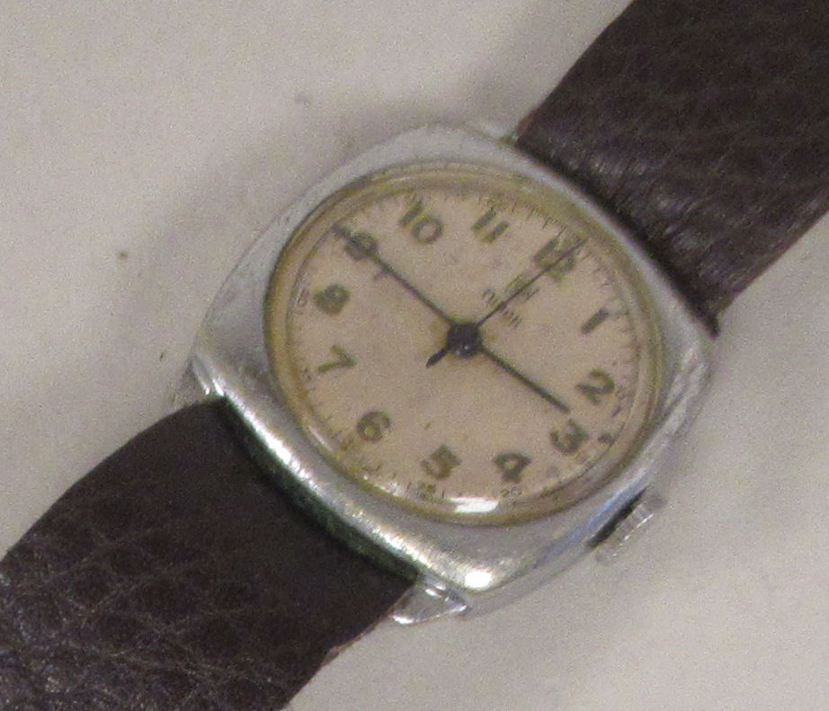 A 1940s Tudor stainless steel cased wristwatch, the movement faced by an Arabic dial, on a brown