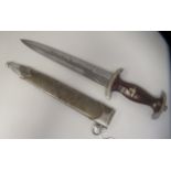 A German Third Reich era SA (Sturmabteilung) dress dagger, the moulded maplewood handle with inset