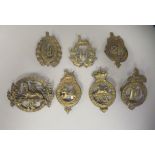 Seven 19thC military brass cap badges, some copies: to include West Norfolk Regt. (Please Note: this