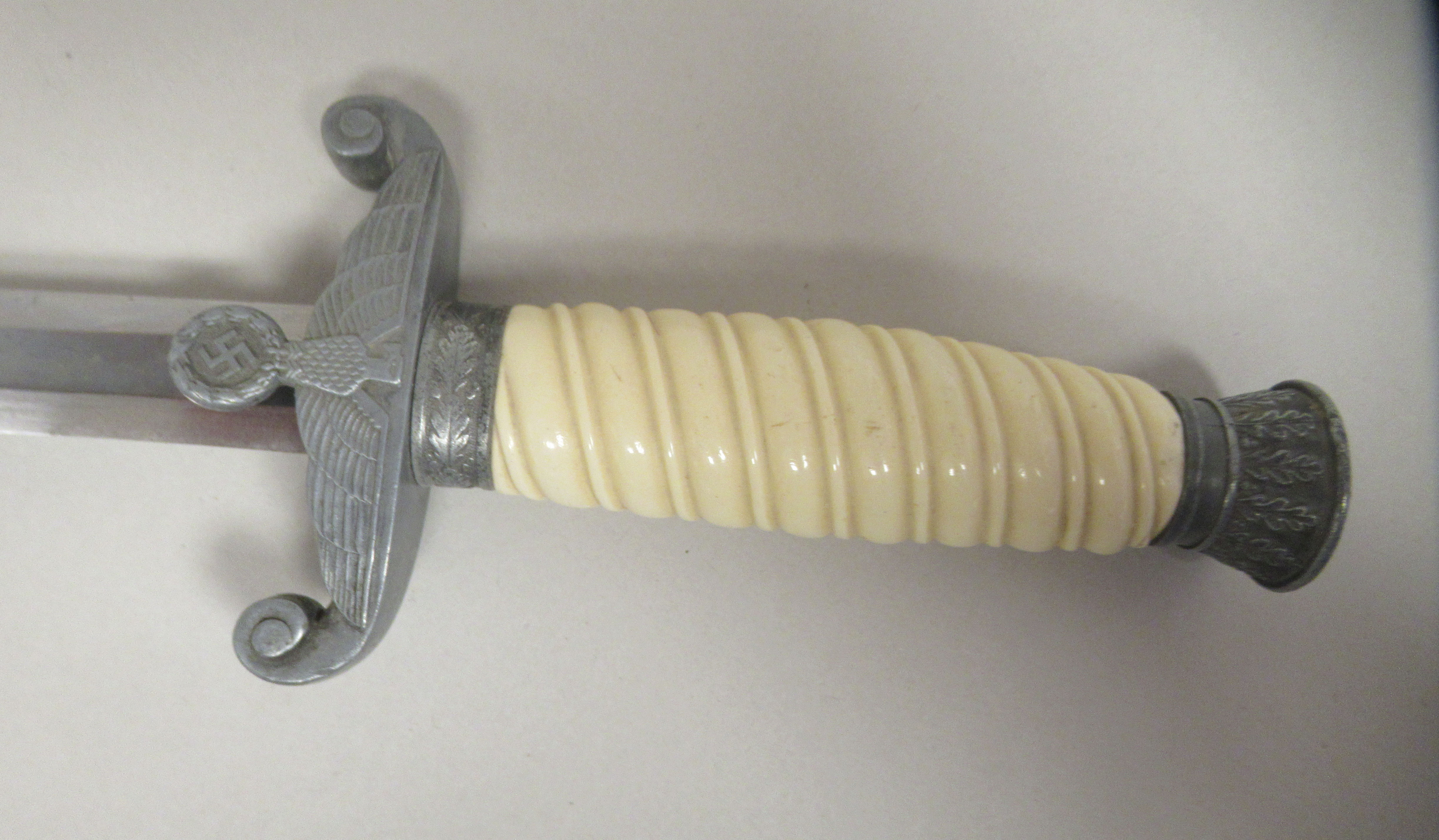 A German Third Reich era army officer's dagger with a wrythen moulded celluloid grip, alloy - Image 3 of 9