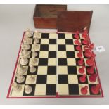 A late 19thC turned naturally coloured bone and beetlenut stained Staunton pattern chess set