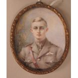 An early 20thC oval head and shoulders portrait miniature, a young, uniformed officer of the RFC