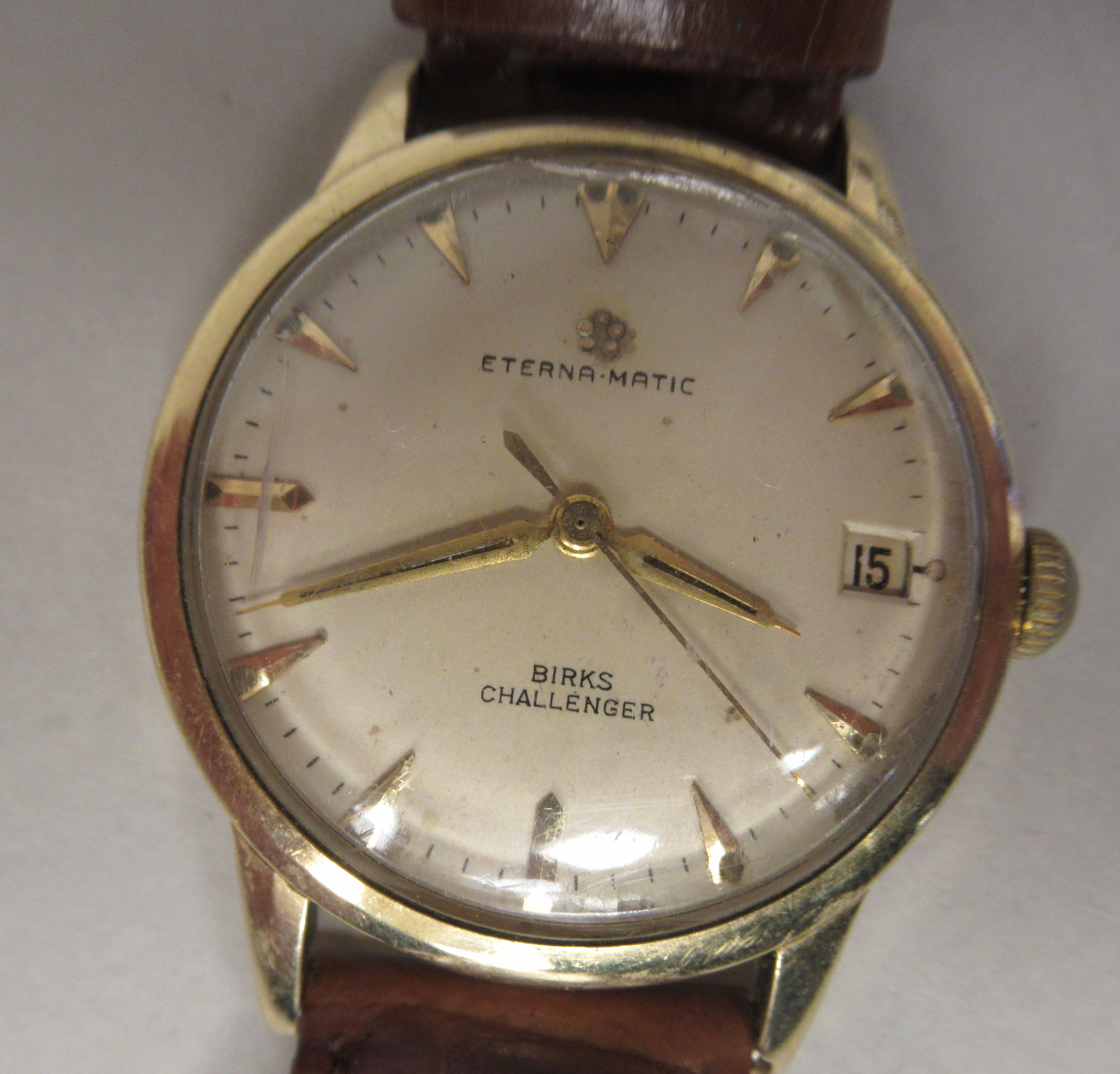 A 9ct gold cased Eterna-Matic wristwatch, the movement inscribed Birks Challenger, faced by a baton