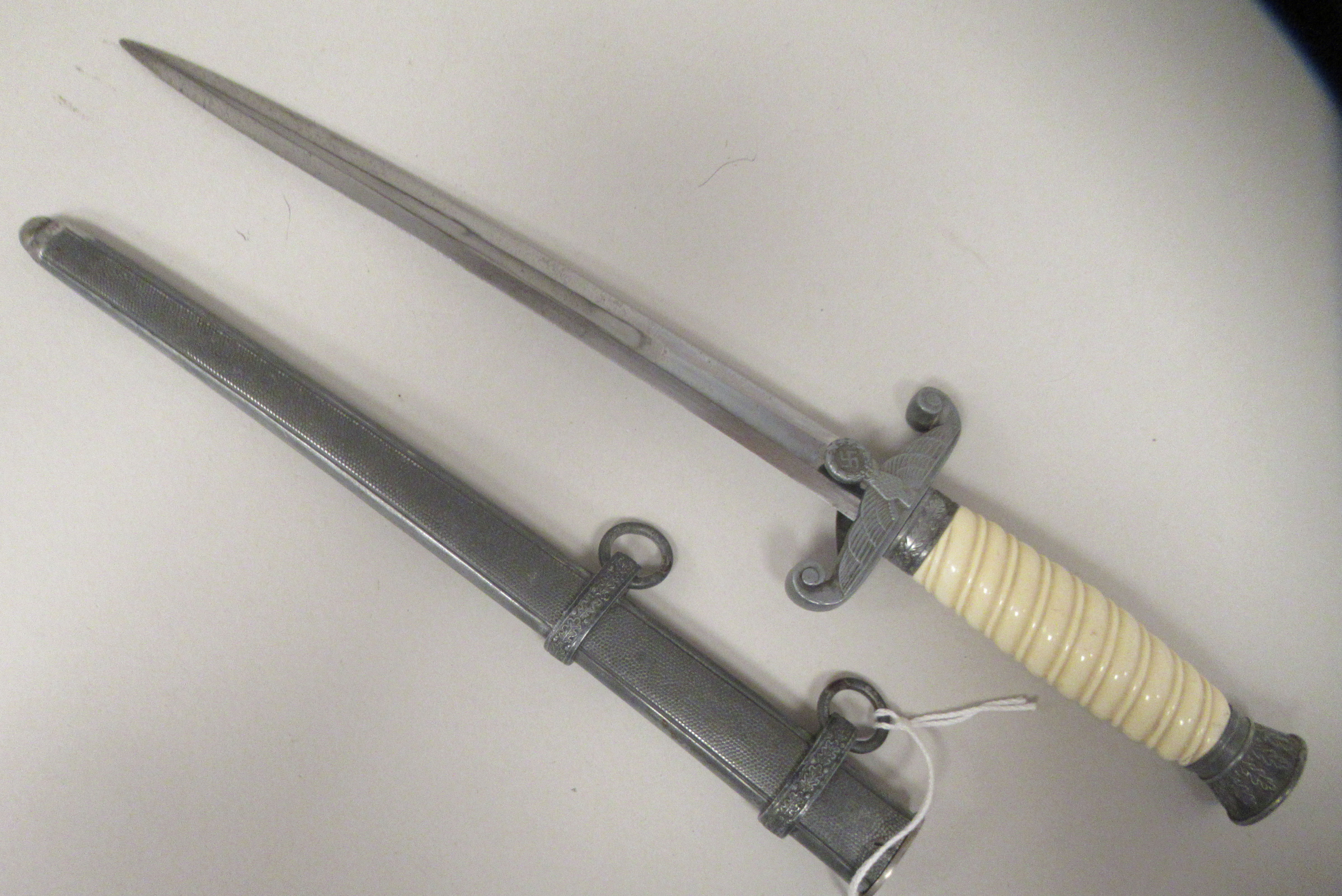 A German Third Reich era army officer's dagger with a wrythen moulded celluloid grip, alloy - Image 2 of 9