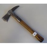 A vintage fireman's axe, the steel head stamped W-Gilpin, made in England, on a wooden handle