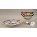 A Chamberlain's Worcester reticulated twin handled porcelain pedestal cup and saucer, brightly