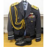 An RAF Senior Officer's uniform, comprising a tunic with medal ribbons and braided epaulettes, a