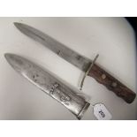 An Italian Fascist era fighting/dress dagger with a rivetted olive wood handgrip, incised with the