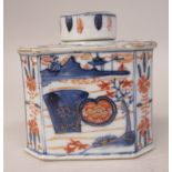 A 19thC Chinese Imari porcelain tea caddy of elongated octagonal form and a cover, decorated in