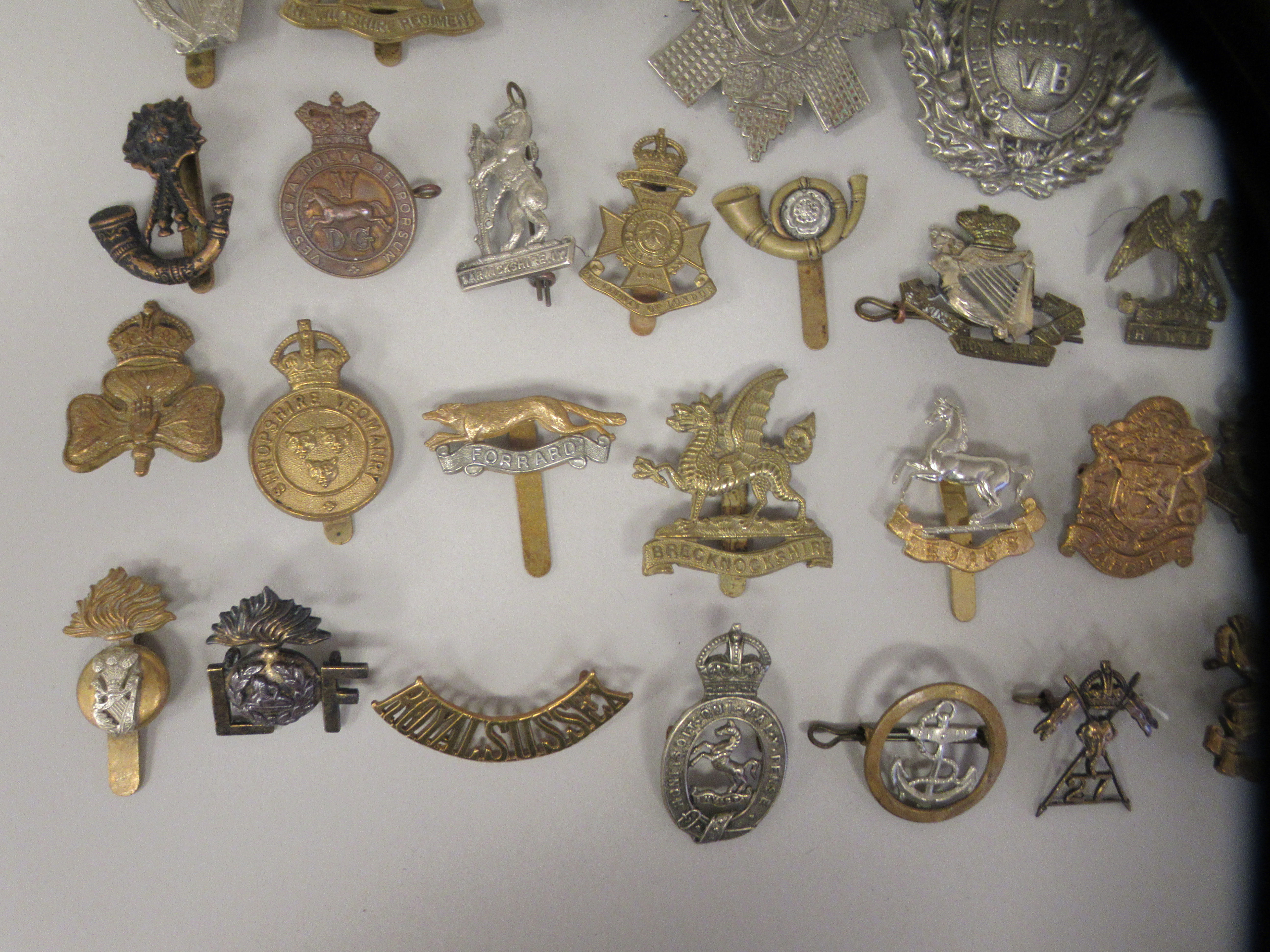 Approx. fifty military cap badges and other insignia, some copies: to include Kings Liverpool Regt.; - Image 5 of 6