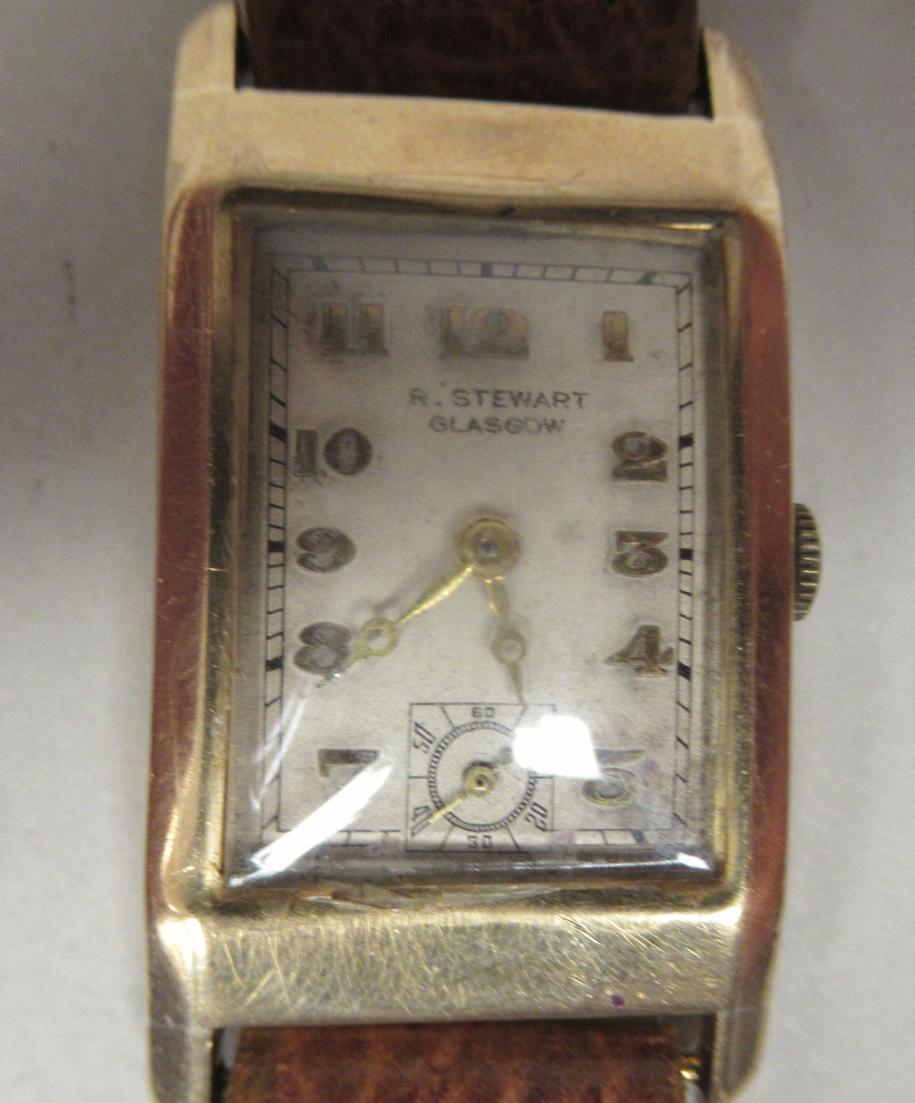 A 9ct gold cased wristwatch, the 15 jewel movement faced by an Arabic dial, inscribed R Stewart of