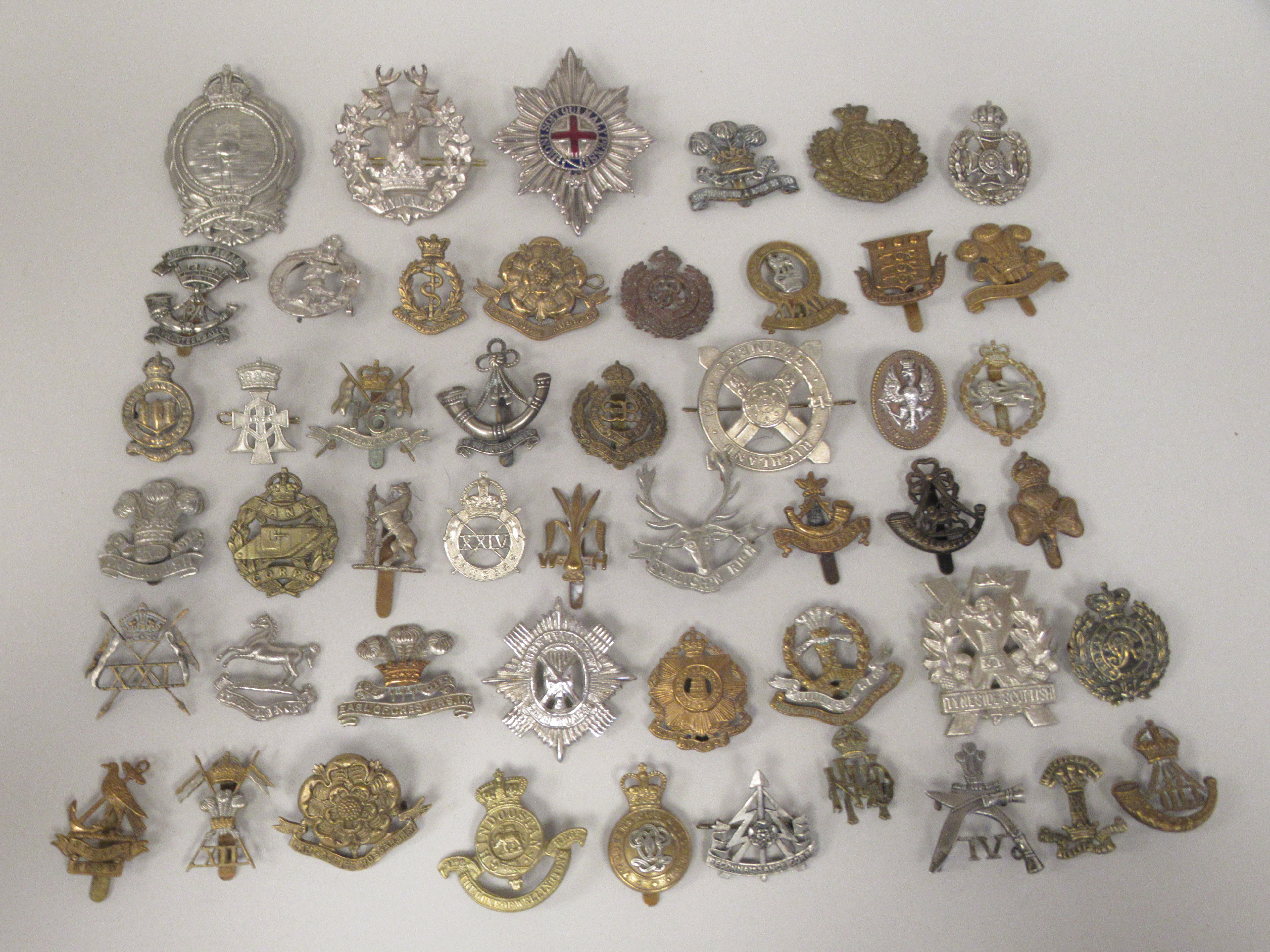 Approx. fifty military cap badges and other insignia, some copies: to include Mine Clearance