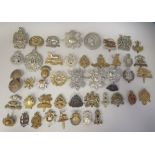 Approx. fifty military cap badges and other insignia, some copies: to include 19th Alexandra PWO