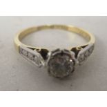 An 18ct gold and platinum claw set single stone diamond ring