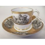 A 19thC Worcester porcelain cup and saucer, decorated in reserves with monochrome classical scenes
