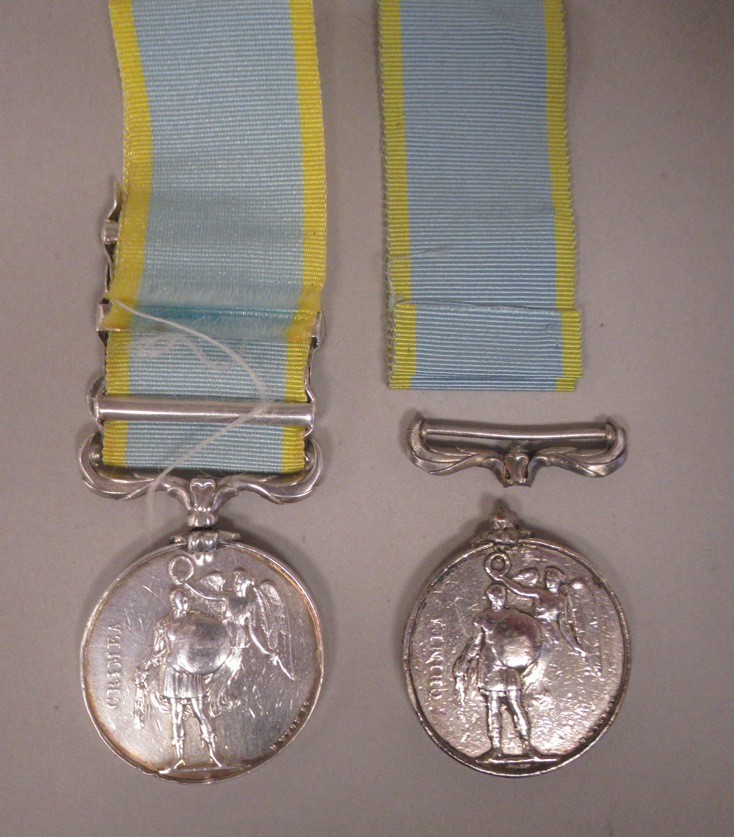 A Crimea medal with Queen Victoria's profile portrait on the obverse and ribbon; three oakleaf - Image 2 of 3