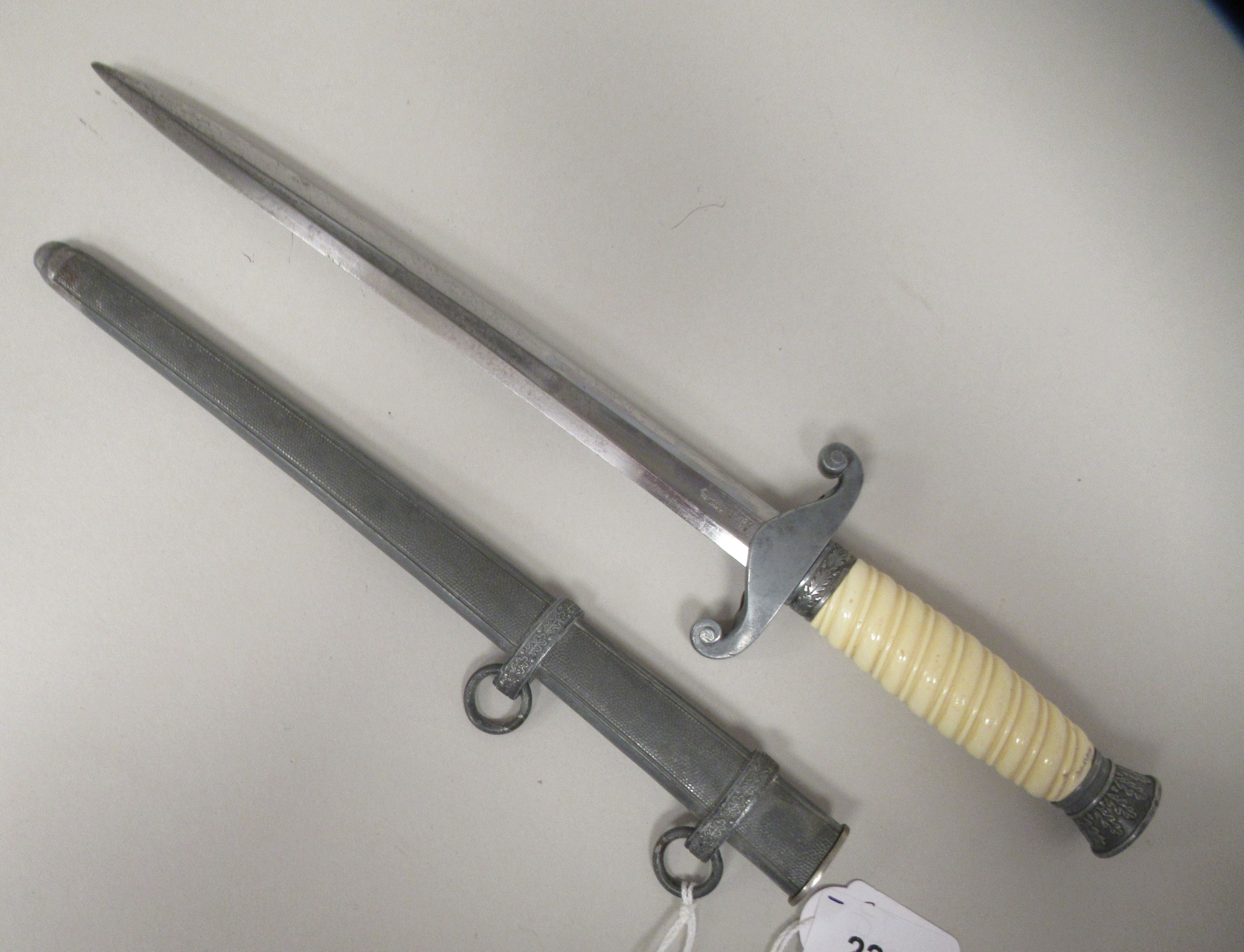 A German Third Reich era army officer's dagger with a wrythen moulded celluloid grip, alloy