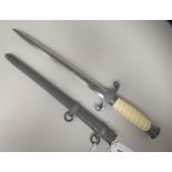 A German Third Reich era army officer's dagger with a wrythen moulded celluloid grip, alloy