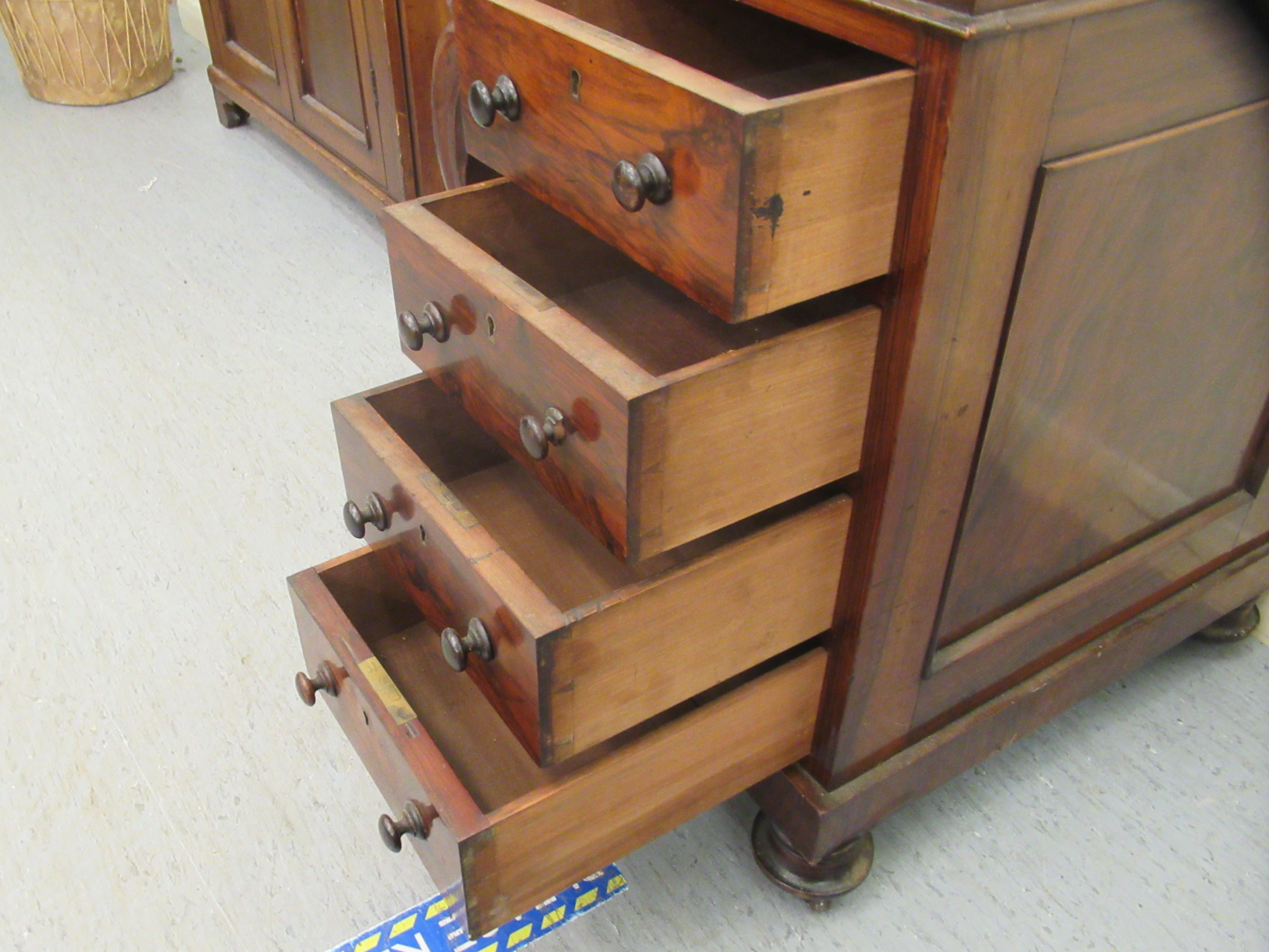 A mid Victorian walnut Davenport with a brass galleried top and an angled, hinged, tooled green hide - Image 7 of 8