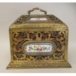 A late 19thC French fabric covered and overlaid engraved, decoratively pierced gilded metal