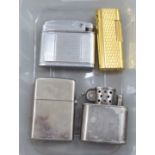 Cigarette lighters: to include a gold plated example  bears a Cartier stamp