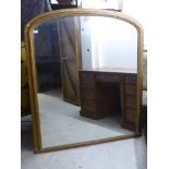 A 19thC overmantel mirror, the round arched plate, set in a plain moulded gilt frame  58" x 50"