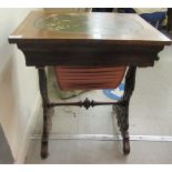 A mid 19thC walnut writing/work table, having a tooled and gilded hide scriber, on a hinged ratchet,