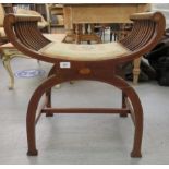 An Edwardian string inlaid mahogany and marquetry Savonarola design stool with a tapestry