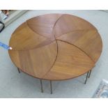 A set of six 1960s Peter Hvidt & Olga Molgaard pinwheel teak occasional tables, each raised