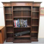 An Edwardian style mahogany and marquetry open breakfront library bookcase with a straight