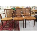 A set of six G-Plan teak framed high back dining chairs with woven split cane panels and pink fabric