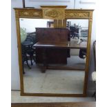 A 19thC overmantle mirror, set in a decorated bead moulded gilt frame  63" x 48"