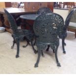 A modern Victorian style green painted cast metal terrace table  28"h  27"dia; and a matching set of