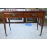 An Edwardian mahogany side table, fitted with two inline shallow drawers, raised on square,