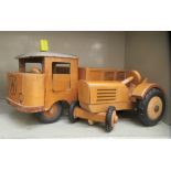 A Friedrich Frobel Werdau carved wooden model dumper truck  8"h; and a tractor  5"h