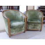 A pair of mid 20thC showwood framed tub design chairs, upholstered in pale sage green fabric, raised