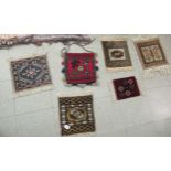 Textiles: to include table covers, hangers and fringed carpet samples  various sizes