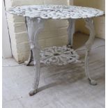 A modern Victorian style white painted cast metal terrace table, raised on sabre legs  17"h  21"dia