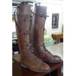 A pair of late 19th/early 20thC gentleman's mid brown leather, buckled and laced knee high, toe