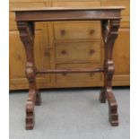 A mid 19thC style oak occasional table with a flame veneered top, raised on scroll carved ends and