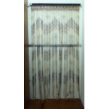 A 1980s bead strung door entrance fly curtain