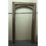 An antiqued/weathered timber door frame  85"h  48"w