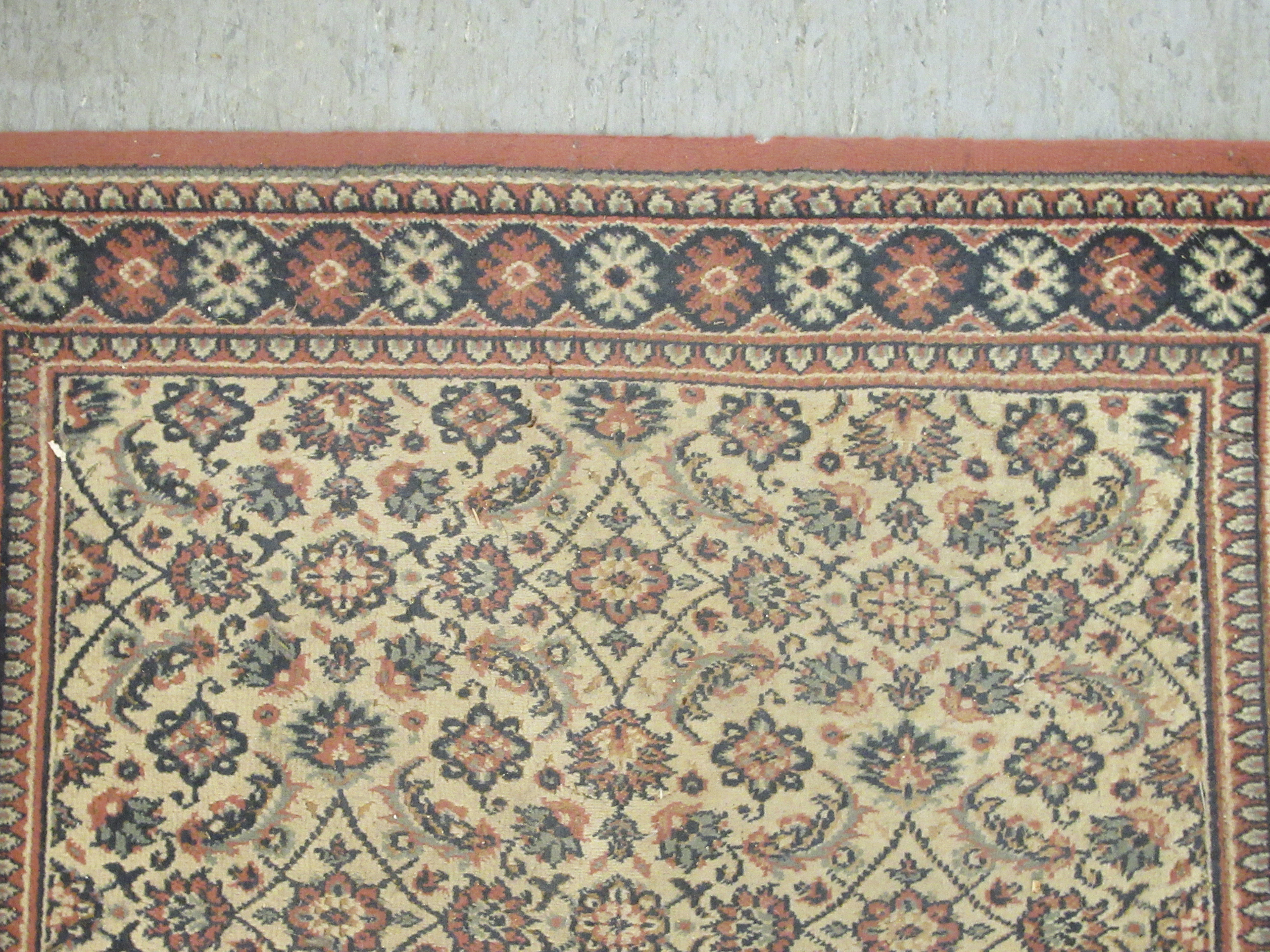 A machine made Persian design runner, decorated with repeating floral designs, on a multi-coloured - Image 4 of 5