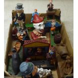A collection of reproduction cast iron and overpainted novelty money boxes: to include one fashioned