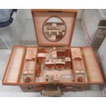 An inter-war period vanity case, in a tan coloured stitched hide with a part fitted interior; and