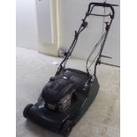A Hayter Harrier 56 petrol driven rotary lawnmower with a 19"dia cut and a grass box