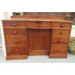 A late Victorian mahogany bow front sideboard, the central, recessed cupboard, flanked by an