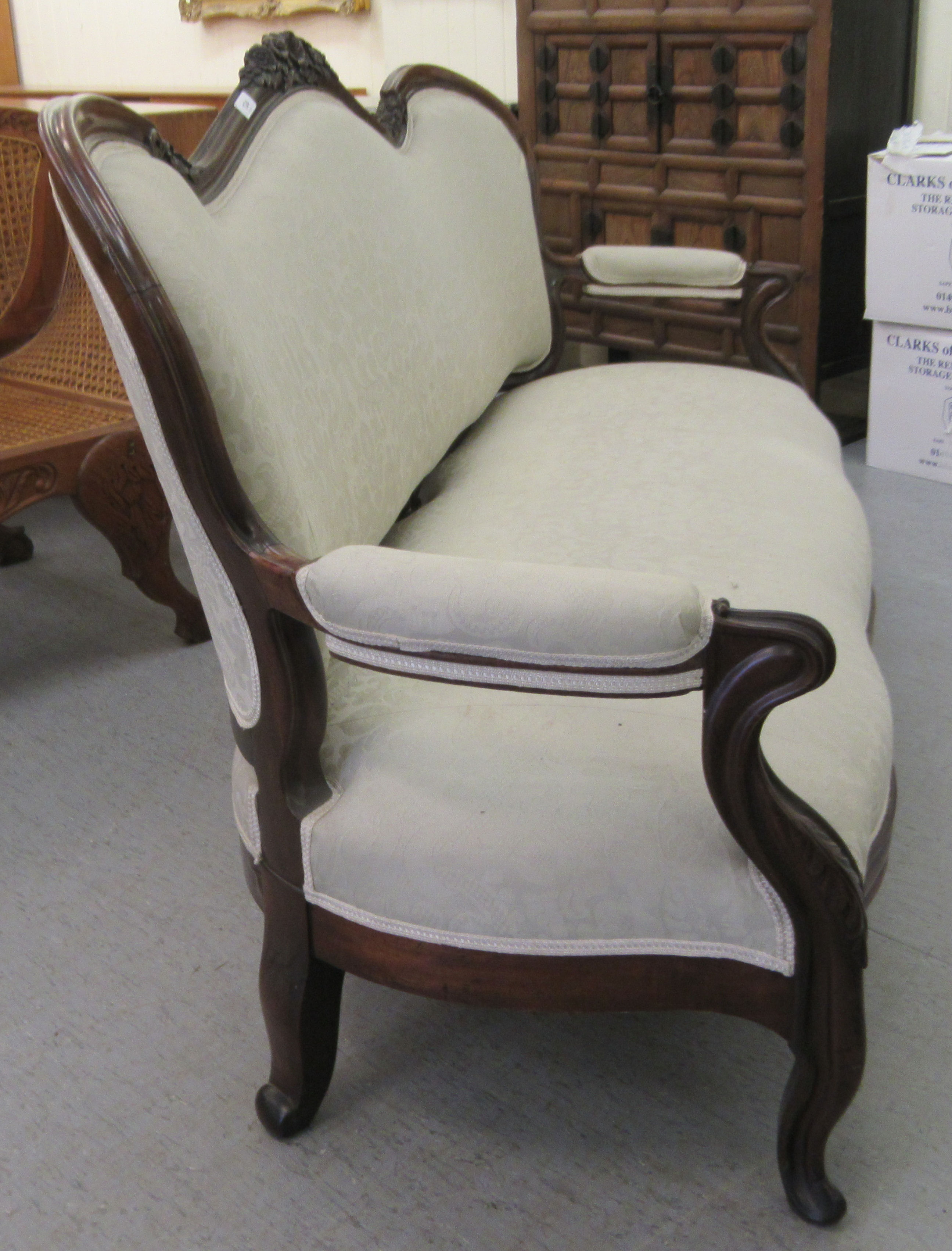 A late Victorian mahogany framed salon settee with a grey fabric upholstered back and seat, raised - Image 3 of 3